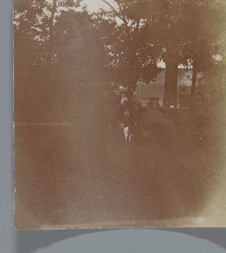 Man in a park, possibly during the Exposition Universelle (World's Fair), Paris, France