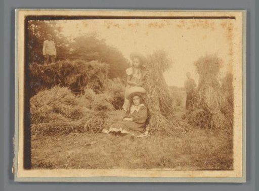 Johanna (Hans) de Jong and Johanna (Nan) Vreede near haystacks in a meadow