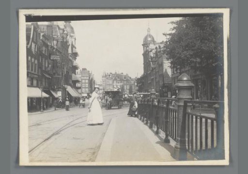 View of a Square with Passersby and Horse-Drawn Trams in Amsterdam