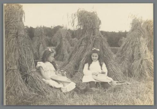 Johanna (Hans) de Jong and Johanna (Nan) Vreede by Stacks of Hay in a Meadow
