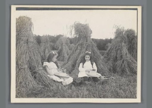 Johanna (Hans) de Jong and Johanna (Nan) Vreede by Stacks of Hay in a Meadow