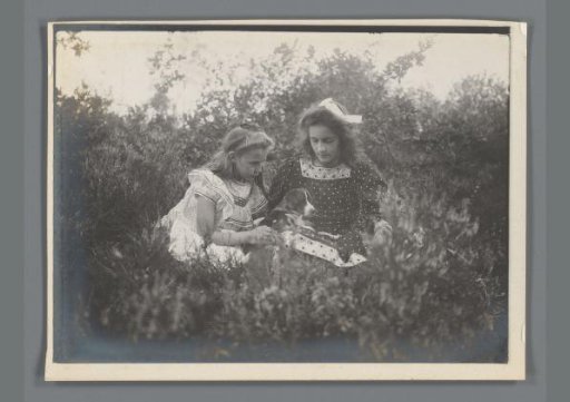 Johanna (Hans) de Jong and Johanna (Nan) Vreede with a Dog on Their Lap in a Heath Landscape