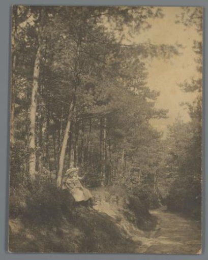 Johanna (Hans) de Jong and possibly Johanna (Nan) Vreede sitting in the forest