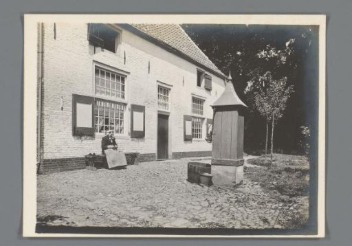 Knitting Woman in Front of a Farm