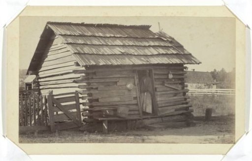 Woman at her wooden house in or near Thomasville, Georgia, United States