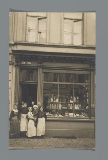 Group of people in front of a shop
