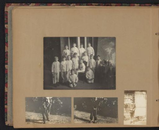 Sheet with a photograph of boys in pyjamas