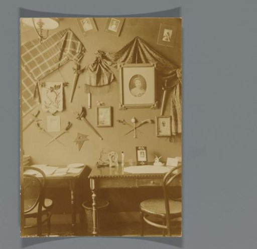 Student room with desk and wall decorations and photos of Frédéric Gabriël Dumas