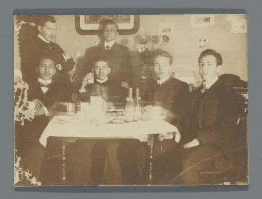 Portrait of Frédéric Dumas and his Delft fellow students, smoking around a table with empty glasses, bottles, and a jug