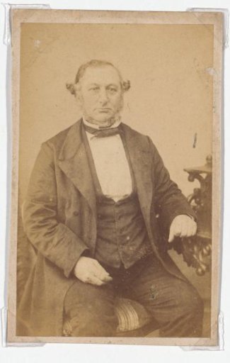 Portrait of a seated man in a coat
