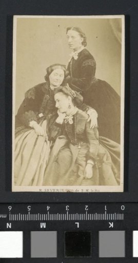 Portrait of three women in long dresses