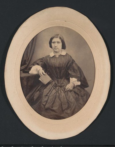 Portrait of a woman in a dress holding a book, possibly belonging to the Nathanson, Hannover family