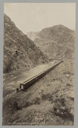 People posing by a train in the Royal Gorge near Cañon City