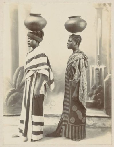 African women in long robes with jugs on their heads