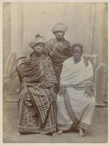 Portrait of three African women in long robes