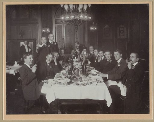 Group portrait of (presumably) a student society during a dinner