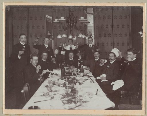 Group portrait of (presumably) a student society during a dinner
