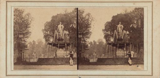 Man posing by a fountain on the Champs-Élysées in Paris
