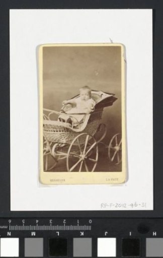 Portrait of a baby in a pram