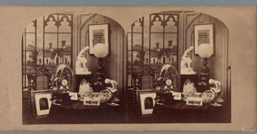 Room interior with a dome clock, statues and lamps and (possibly) photographs