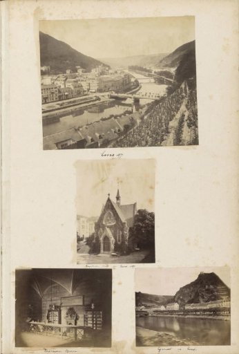View of houses along the bank of the Lahn in Bad Ems with a mountain behind