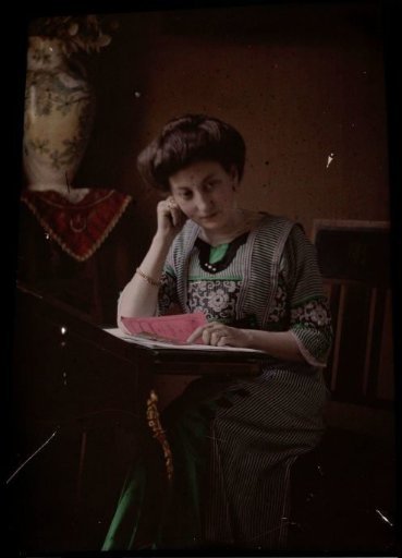 Woman behind a reading desk