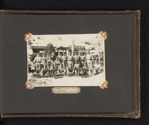Group portrait of unknown Japanese soldiers with military ordnance