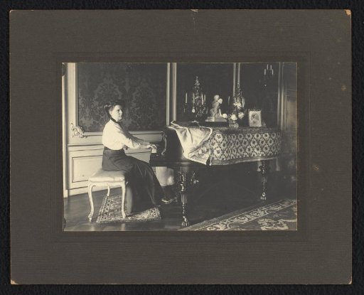 Go Kessler behind a piano