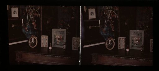 Interior with piano and framed artworks