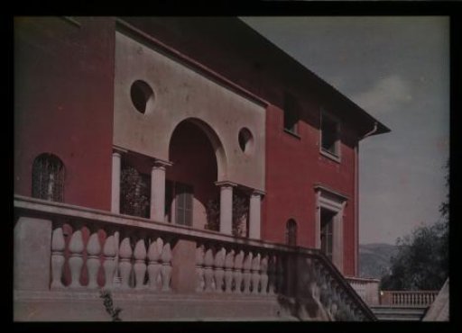 Part of a pink stucco house