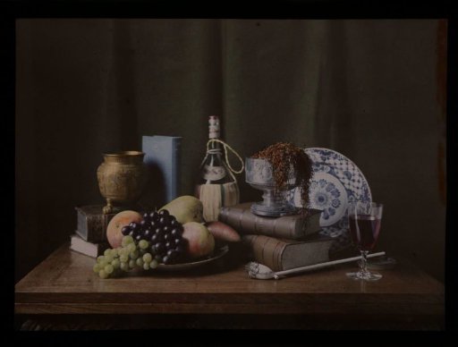 Still life with fruit, books and a pipe