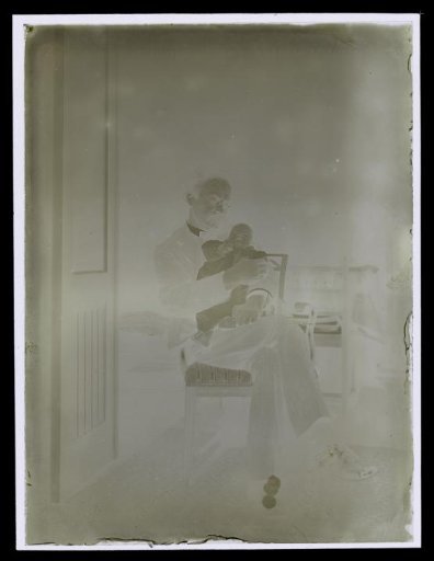 Alphons Diepenbrock holding a baby, possibly his daughter Thea Diepenbrock