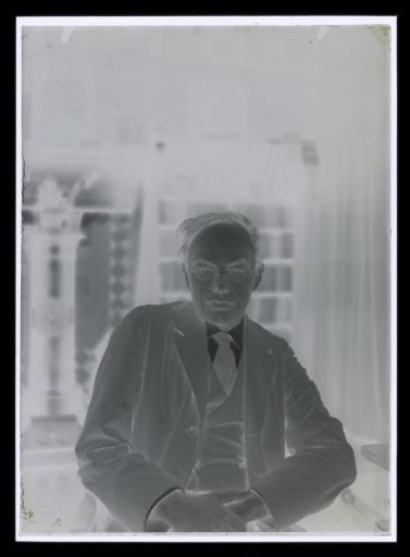 Portrait of Alphons Diepenbrock seated in his house 'Holtwick' at Laren