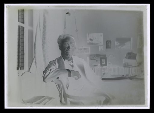 Portrait of Alphons Diepenbrock seated on a chair in a room