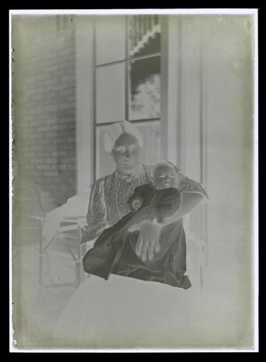 Elsa Diepenbrock with a baby, possibly Thea Diepenbrock, in a christening gown