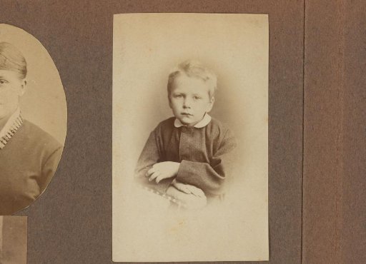 Portrait of a young boy with crossed arms