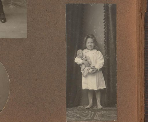 Studio Portrait of Thea Diepenbrock with a Doll