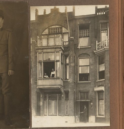 House with Bay Window Featuring Two Women and a Man with a Bicycle in the Doorway