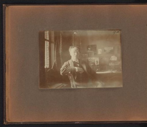 Page from the Diepenbrock family photo album with a photograph of Alphons Diepenbrock in an interior