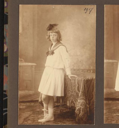 Studio Portrait of an Unknown Girl Leaning on a Table with a Cloth