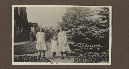 Joanna and Thea Diepenbrock and an unknown girl in a garden with conifers, presumably for country house De Bijlakker