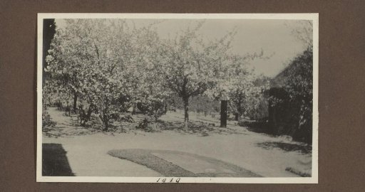 View of a garden with blossoming trees, presumably near country house De Bijlakker