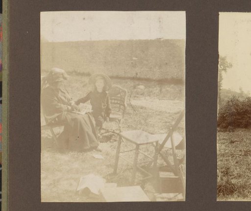 Two women sitting in a garden