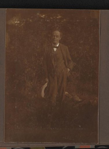 Portrait of Alphons Diepenbrock standing with hat in hand