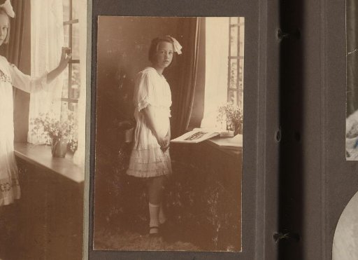 Thea Diepenbrock Standing with a Book by a Window Sill