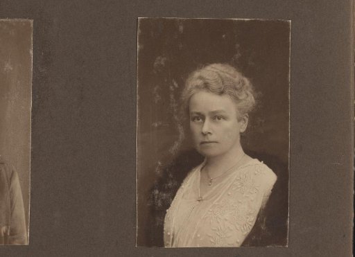 Portrait of a woman with her hair up, embroidered blouse and fur coat