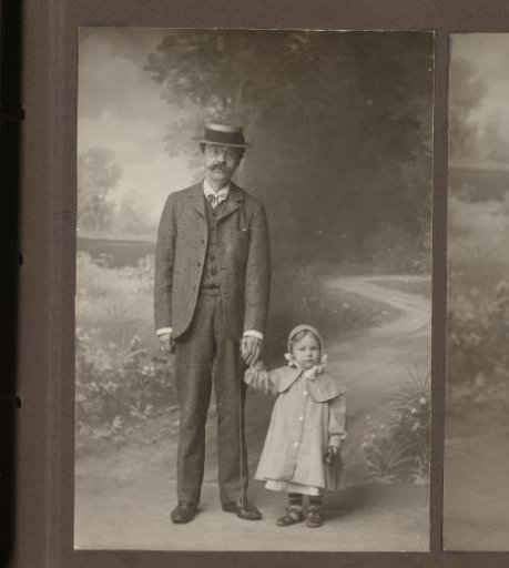 Studio portrait of Alphons Diepenbrock with daughter Joanna by the hand