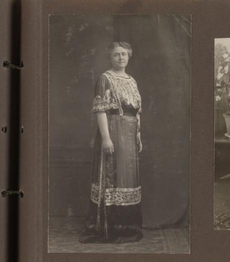 Portrait of a standing woman in an evening dress