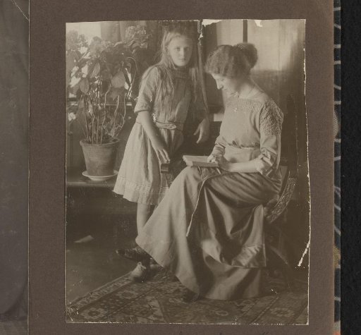 Portrait of a Reading Woman with a Girl in the Living Room of Villa De Hoeve