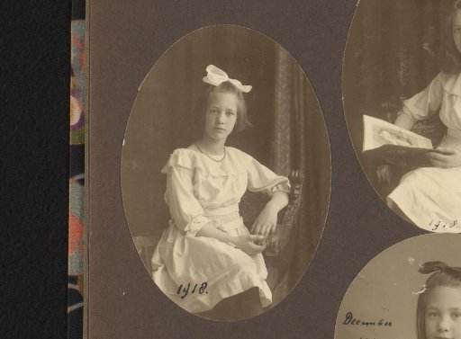 Portrait of Thea Diepenbrock seated on a chair with a bow in her hair